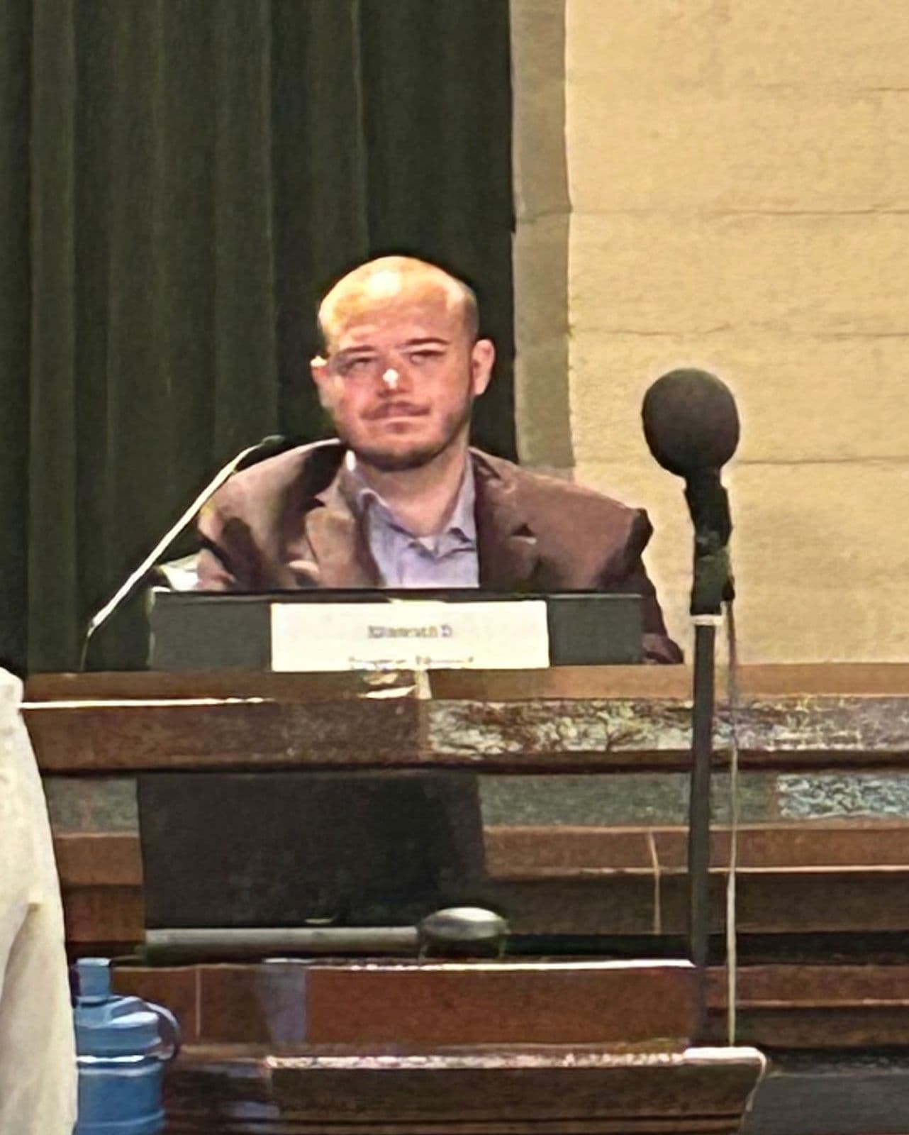 Justin Hurst on the dais at the League of Women Voters candidate forum